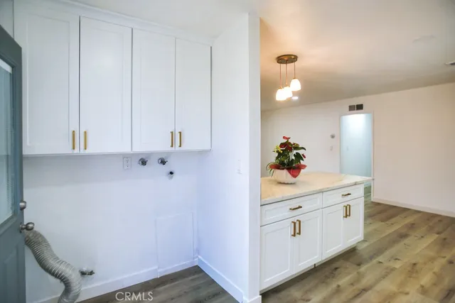 a room with a cabinets and flowerpot