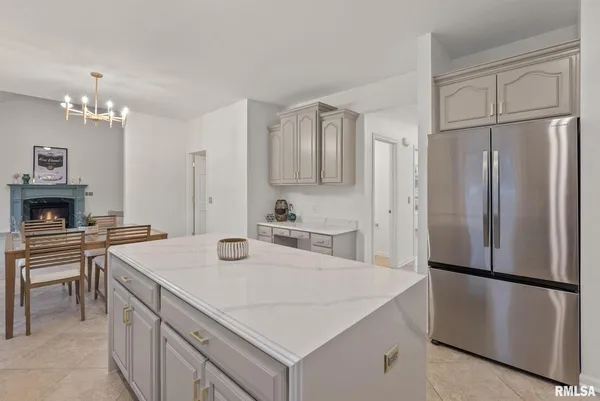 a kitchen with a refrigerator a stove a sink and a refrigerator