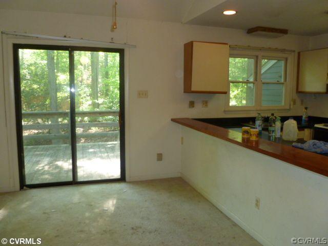 5606 Woods Walk Road Midlothian, VA 23112 - Photo 4 of 6 a kitchen with stainless steel appliances granite countertop a sink a stove and a granite counter top