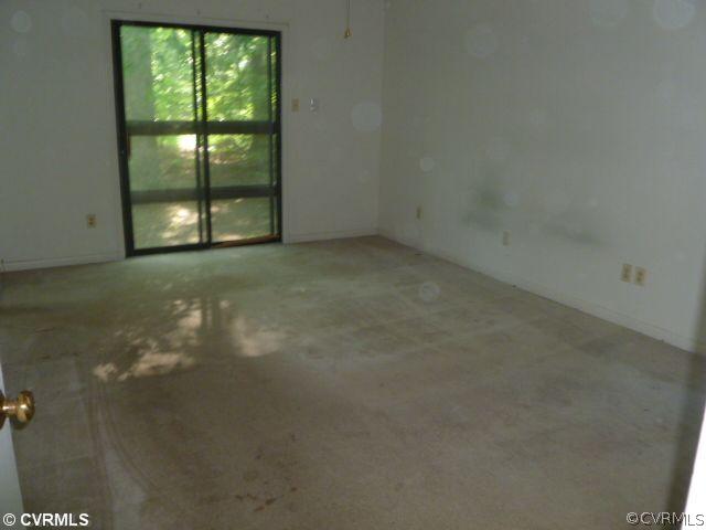 5606 Woods Walk Road Midlothian, VA 23112 - Photo 5 of 6 a view of an empty room with a window