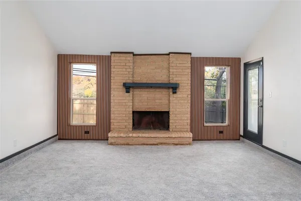 an empty room with a fireplace