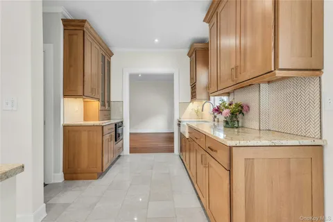 a kitchen with a sink and refrigerator
