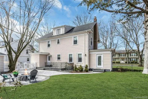 a front view of house with yard and seating area