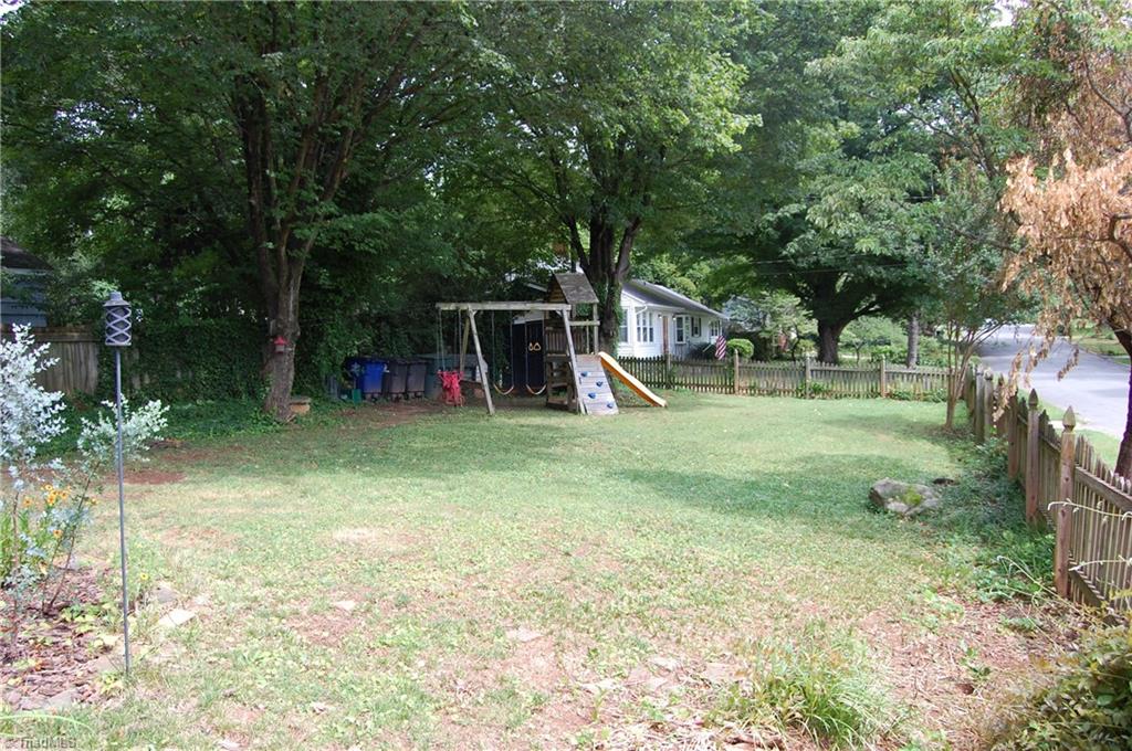 2121 Elgin Road Winston-Salem, NC 27103 - Photo 23 of 23 Another view of the fenced rear yard with swing set