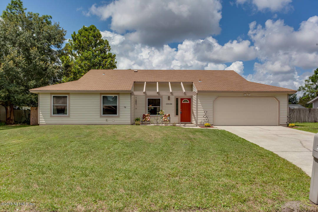 10836 Reading Road Jacksonville, FL 32257 - Photo 1 of 32 a front view of a house with a garden and yard