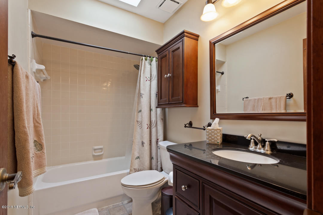 10836 Reading Road Jacksonville, FL 32257 - Photo 14 of 32 a bathroom with a granite countertop sink toilet and shower