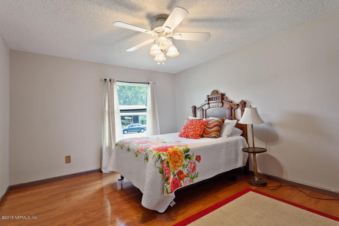10836 Reading Road Jacksonville, FL 32257 - Photo 15 of 32 a bedroom with a bed and a window