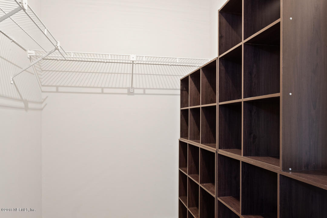 10836 Reading Road Jacksonville, FL 32257 - Photo 19 of 32 a view of a closet with racks on the wall