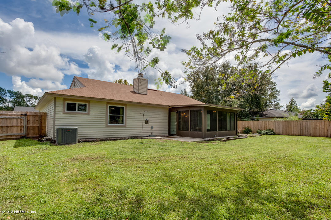 10836 Reading Road Jacksonville, FL 32257 - Photo 27 of 32 a front view of house with yard and trees