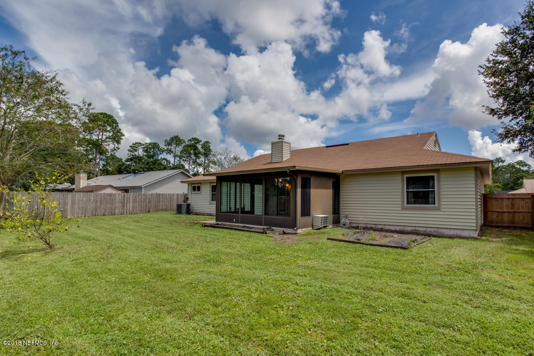 10836 Reading Road Jacksonville, FL 32257 - Photo 29 of 32 a view of a house with a yard and sitting area