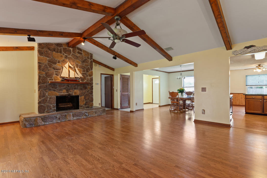 10836 Reading Road Jacksonville, FL 32257 - Photo 6 of 32 a view of a livingroom with furniture and a fireplace