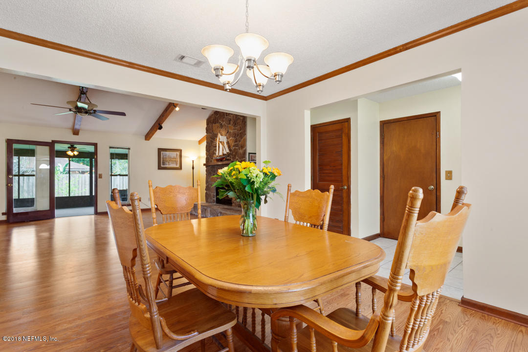 10836 Reading Road Jacksonville, FL 32257 - Photo 8 of 32 a view of a dining room with furniture and wooden floor