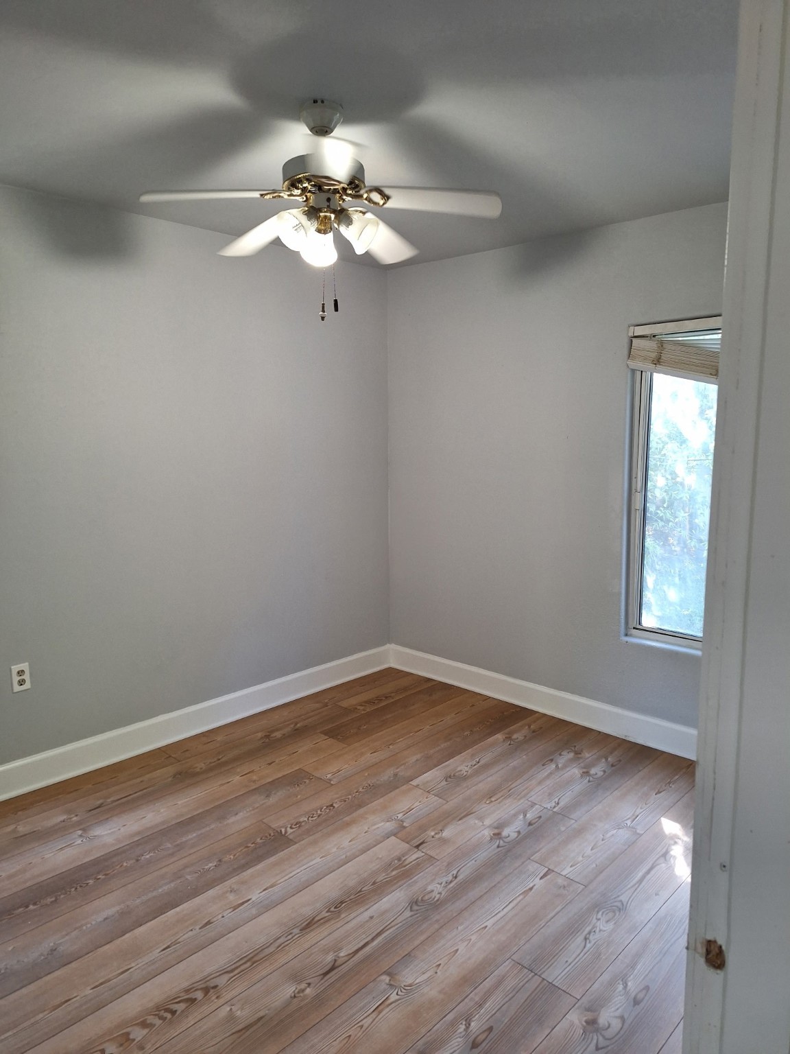 6316 Longview Street Houston, TX 77020 - Photo 3 of 6 a view of a room with wooden floor and chandelier