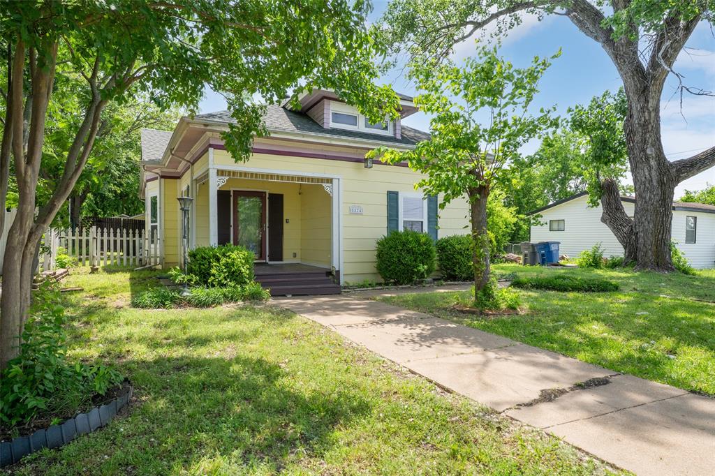 5824 Boone Street Sachse, TX 75048 - Photo 1 of 40 a front view of a house with garden