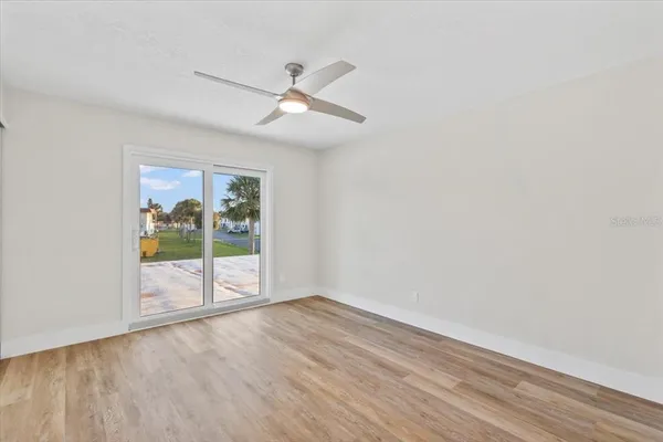 a bathroom with a granite countertop sink a toilet and a shower