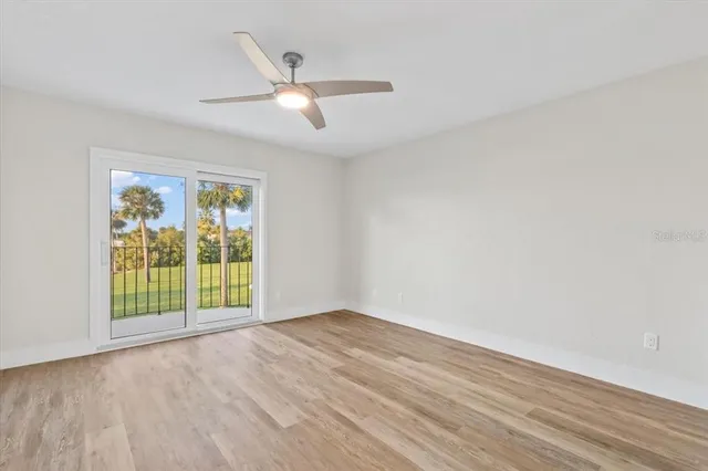 a view of a swimming pool with an outdoor space and seating area