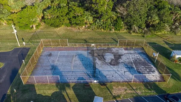 an aerial view of a house with a back yard