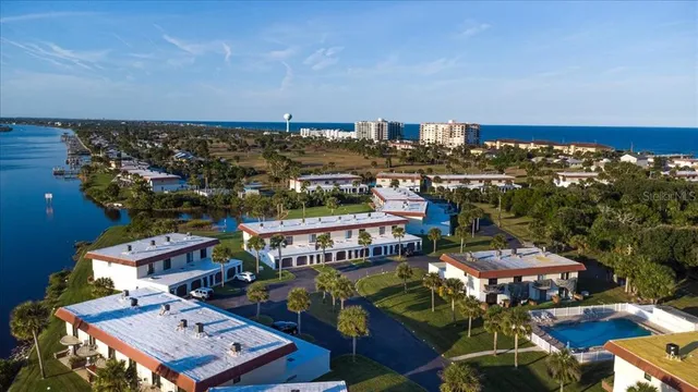 an aerial view of a house with outdoor space swimming pool and lake view