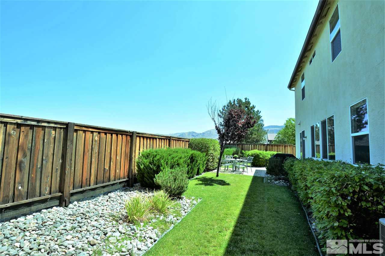 445 Manciano Way Reno, NV 89521 - Photo 23 of 28 a view of a backyard with plants