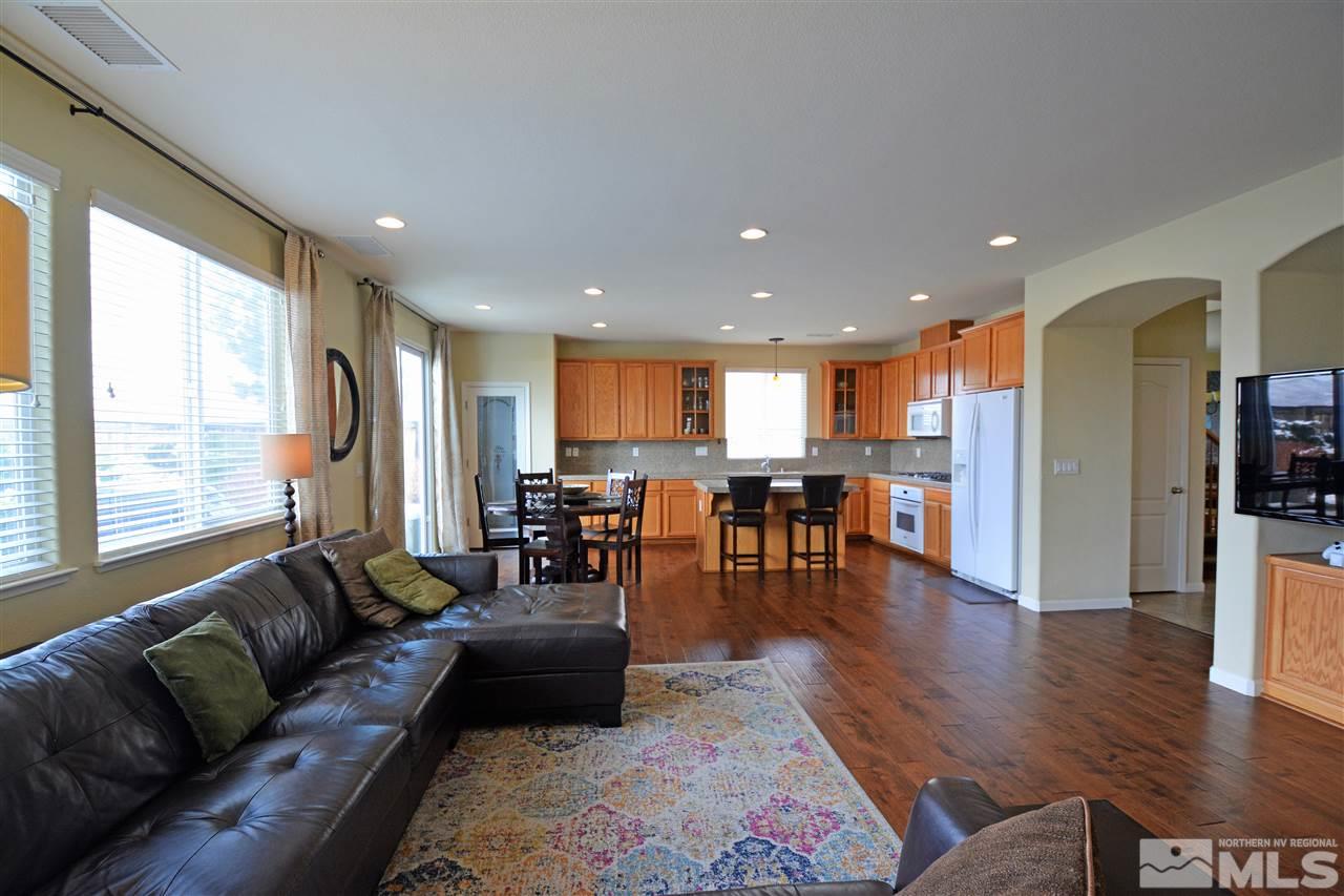 445 Manciano Way Reno, NV 89521 - Photo 3 of 28 a living room with furniture wooden floor and a table