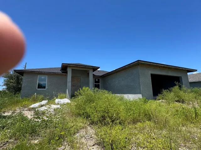 a house with trees in front of it