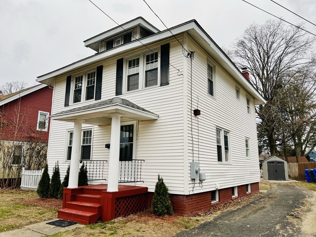 781 White Street Springfield, MA 01108 - Photo 1 of 25 a front view of a house with a garage