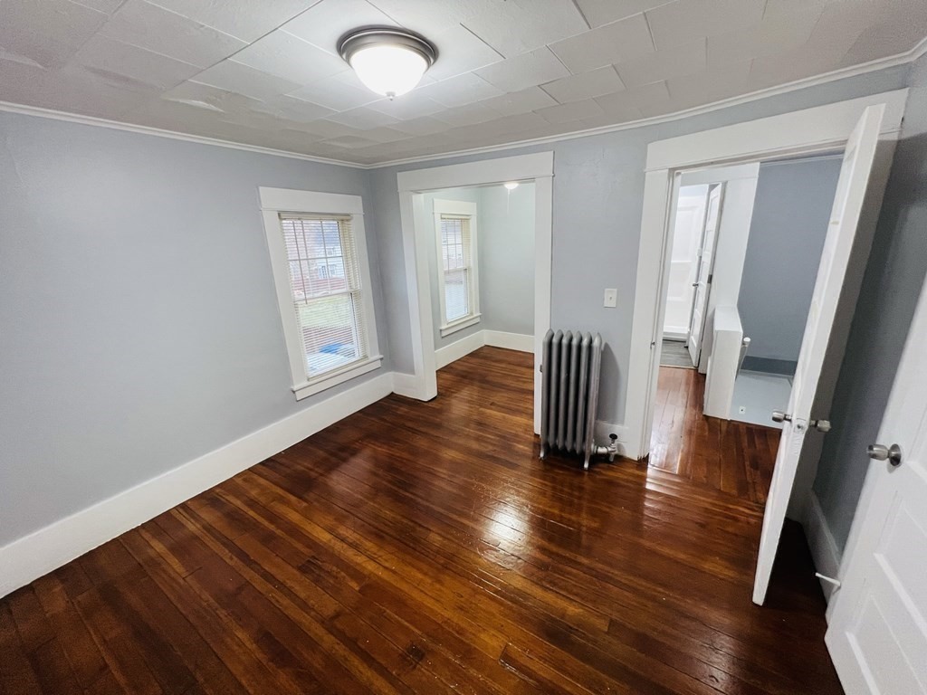 781 White Street Springfield, MA 01108 - Photo 18 of 25 wooden floor in an empty room with a mirror