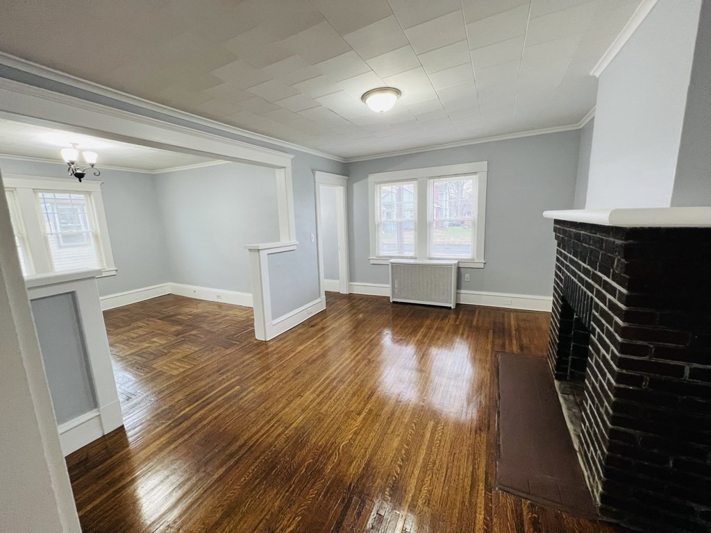 781 White Street Springfield, MA 01108 - Photo 5 of 25 wooden floor in an empty room with a window