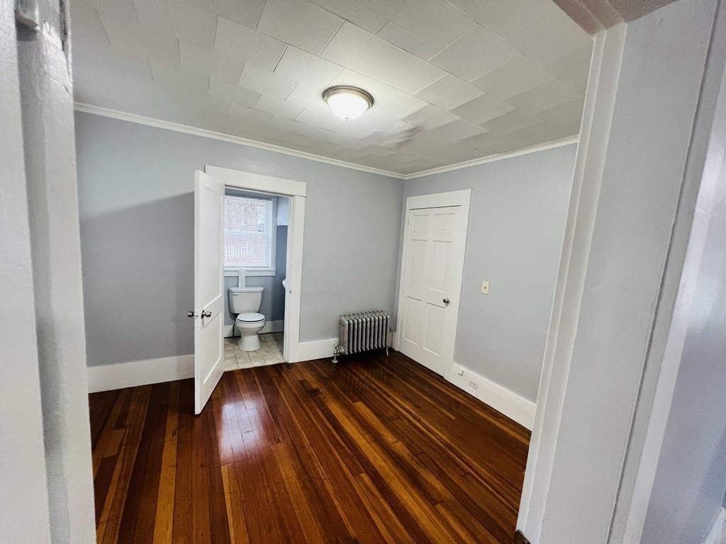 781 White Street Springfield, MA 01108 - Photo 7 of 25 a view of empty room with wooden floor