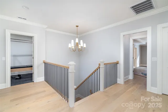 a view of a hallway to a bedroom