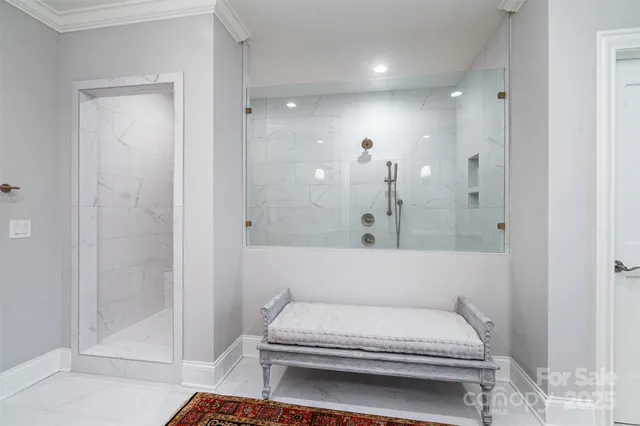 a bathroom with a bathtub and a shower