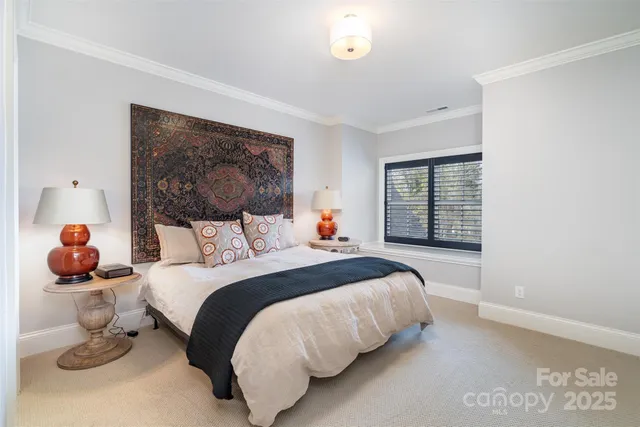 a bed room with a bed and a window