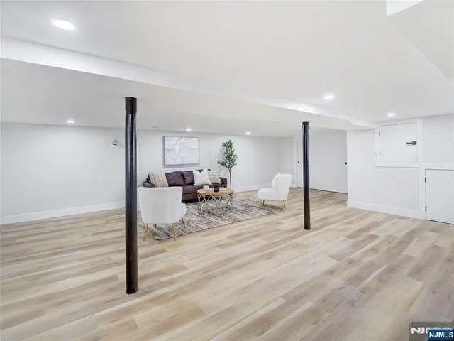 a view of a hall with wooden floor