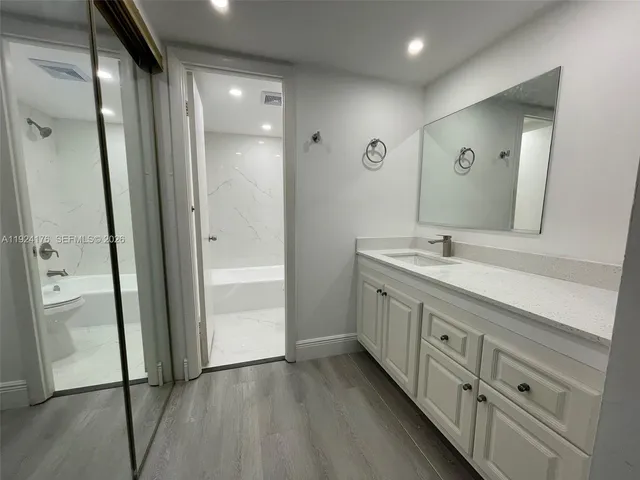 a bathroom with 2 sink and a mirror