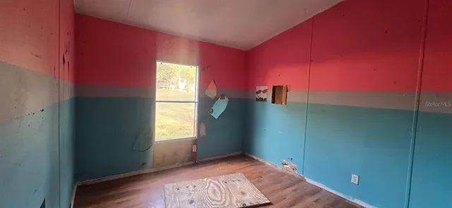 a view of an empty room and window