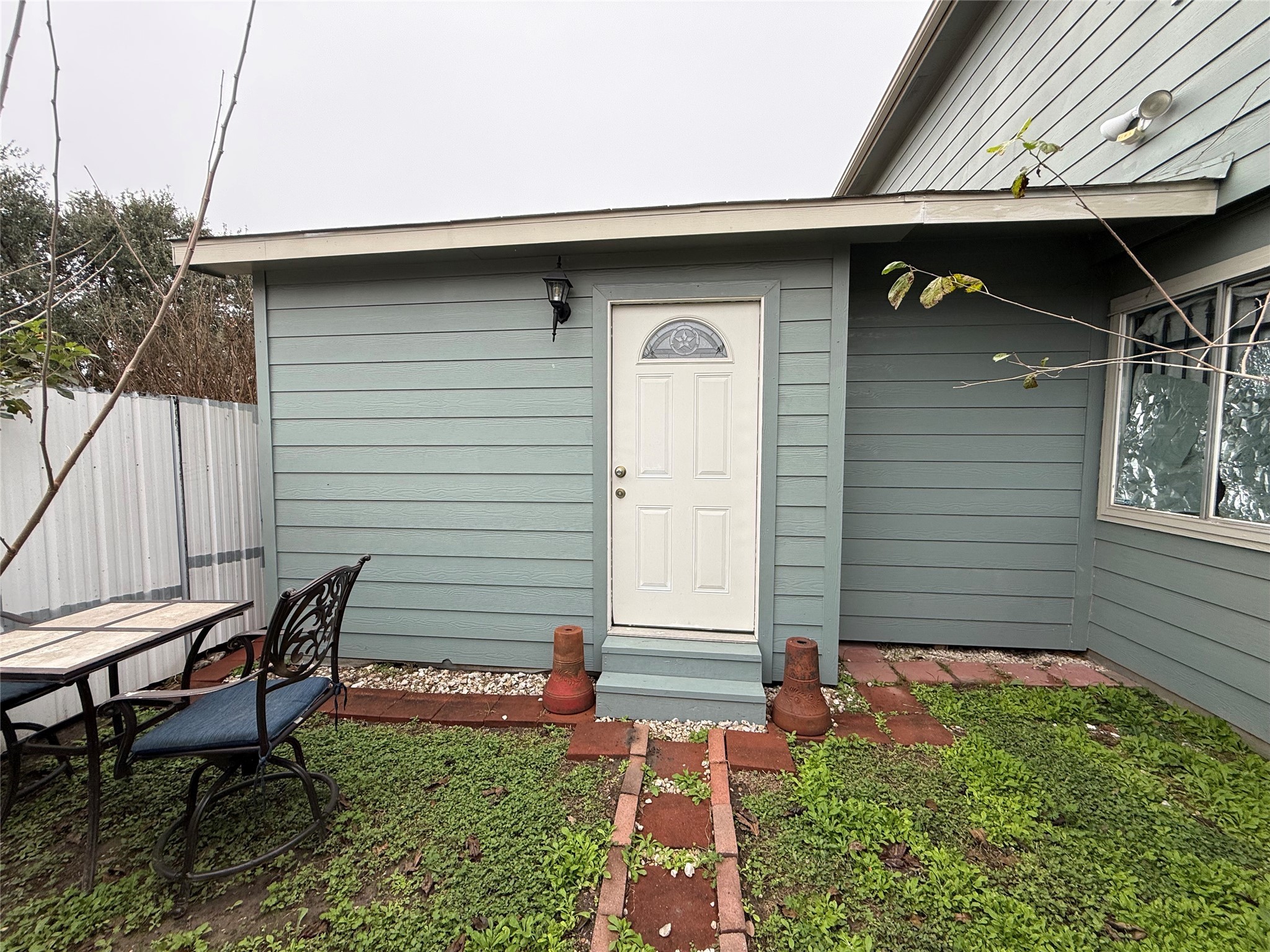 a side view of a house with patio