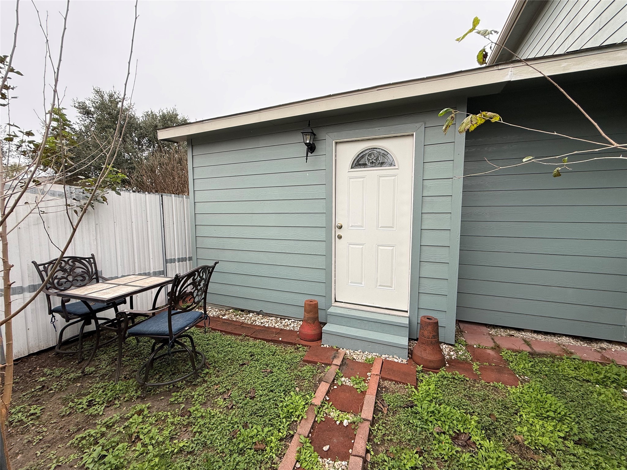 3310 Vega Houston, TX 77088 - Photo 2 of 8 a backyard of a house with table and chairs