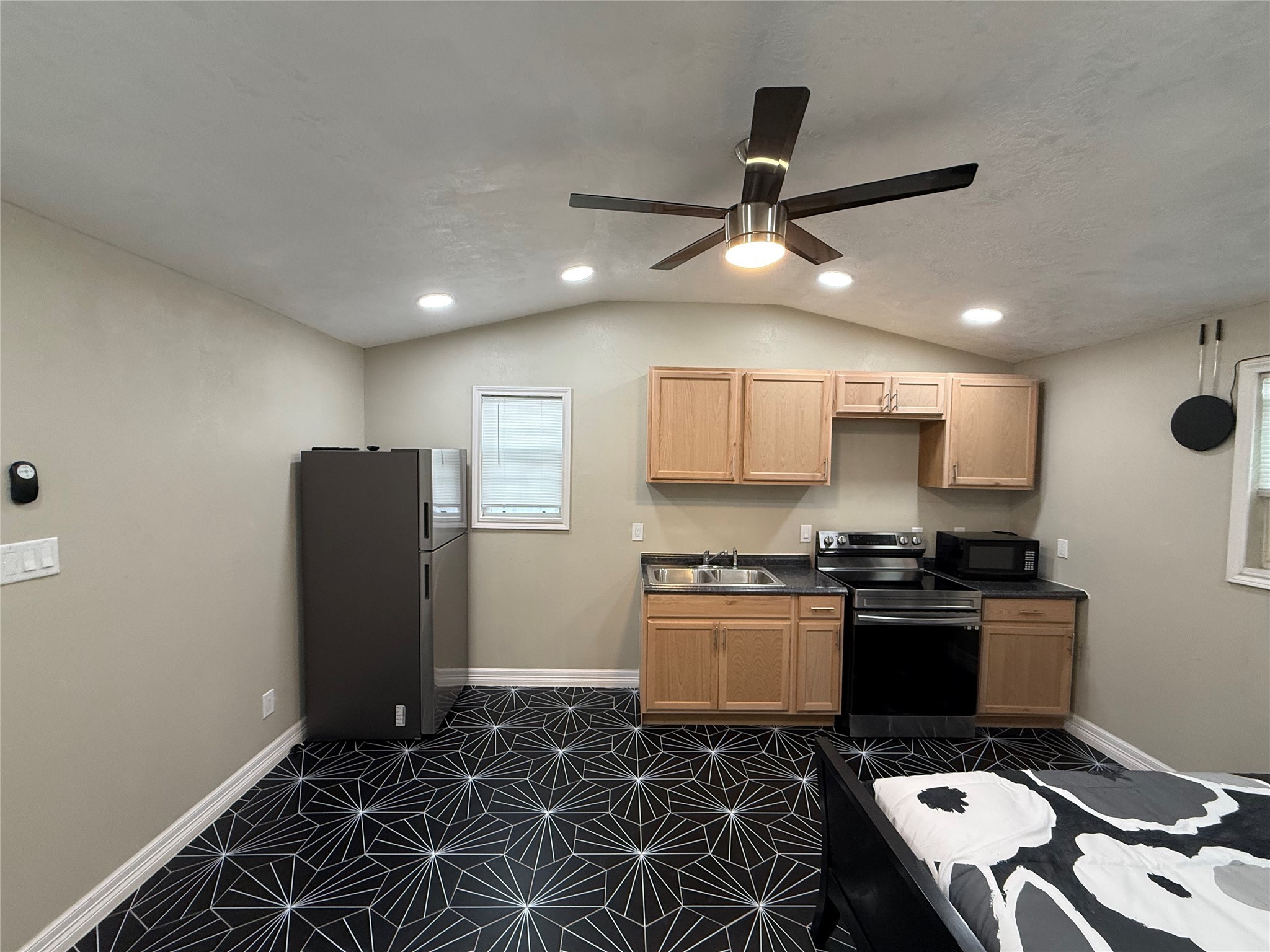 3310 Vega Houston, TX 77088 - Photo 4 of 8 a kitchen with stainless steel appliances granite countertop a stove a refrigerator a sink a refrigerator and island
