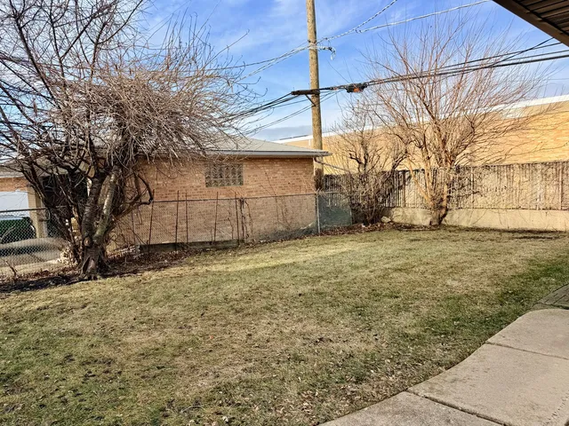 a view of a backyard of the house
