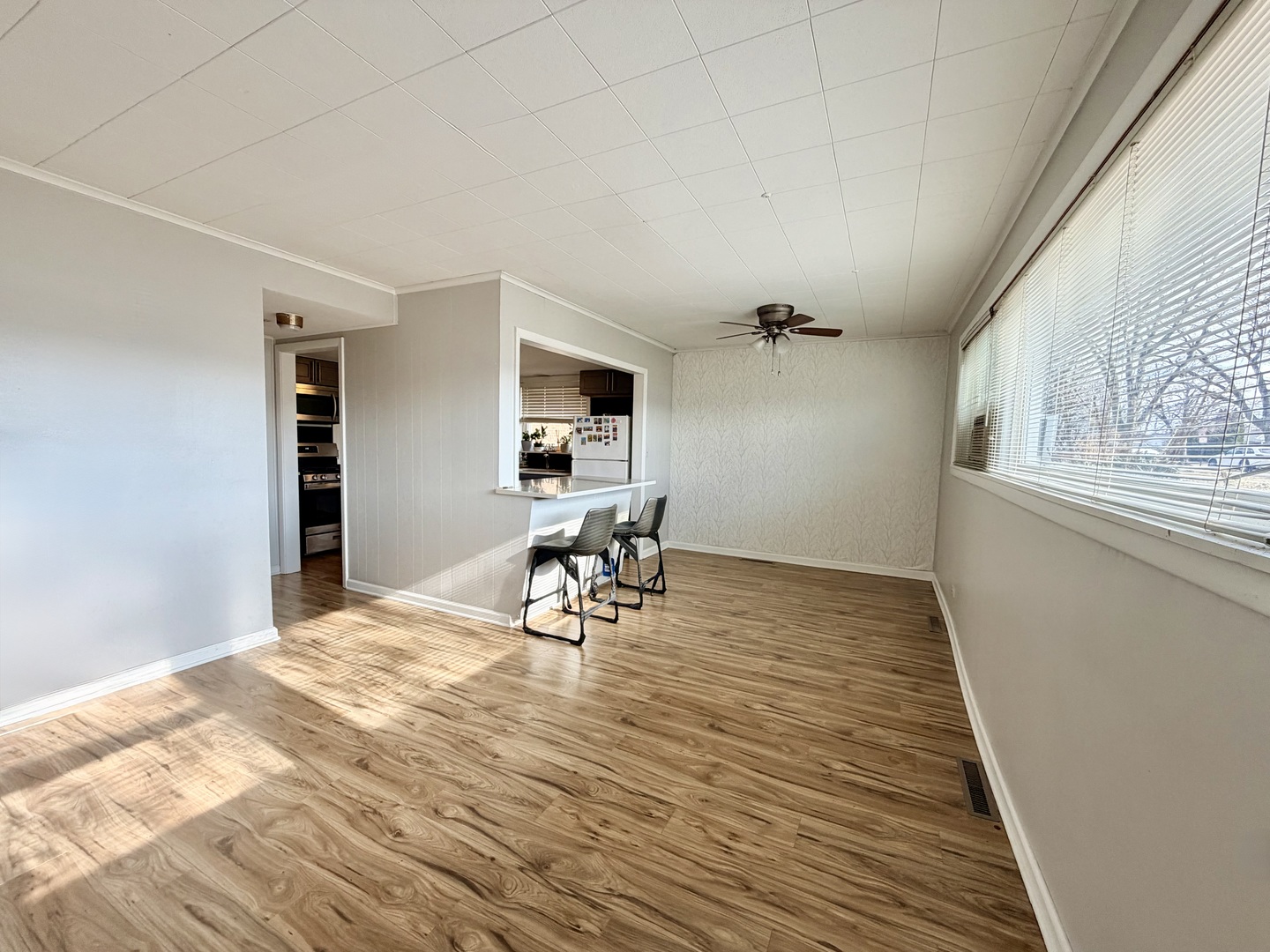 7238 West Crain Street, Unit G Niles, IL 60714 - Photo 2 of 11 a view of a workspace with furniture and a window