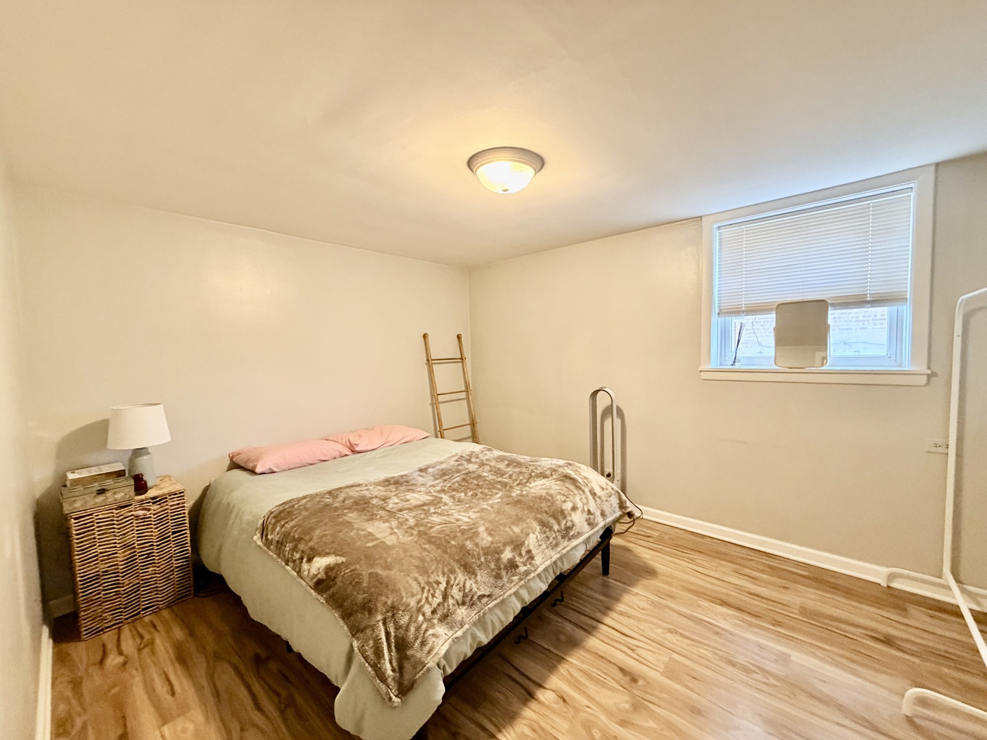 7238 West Crain Street, Unit G Niles, IL 60714 - Photo 6 of 11 a bedroom with a bed and wooden floor