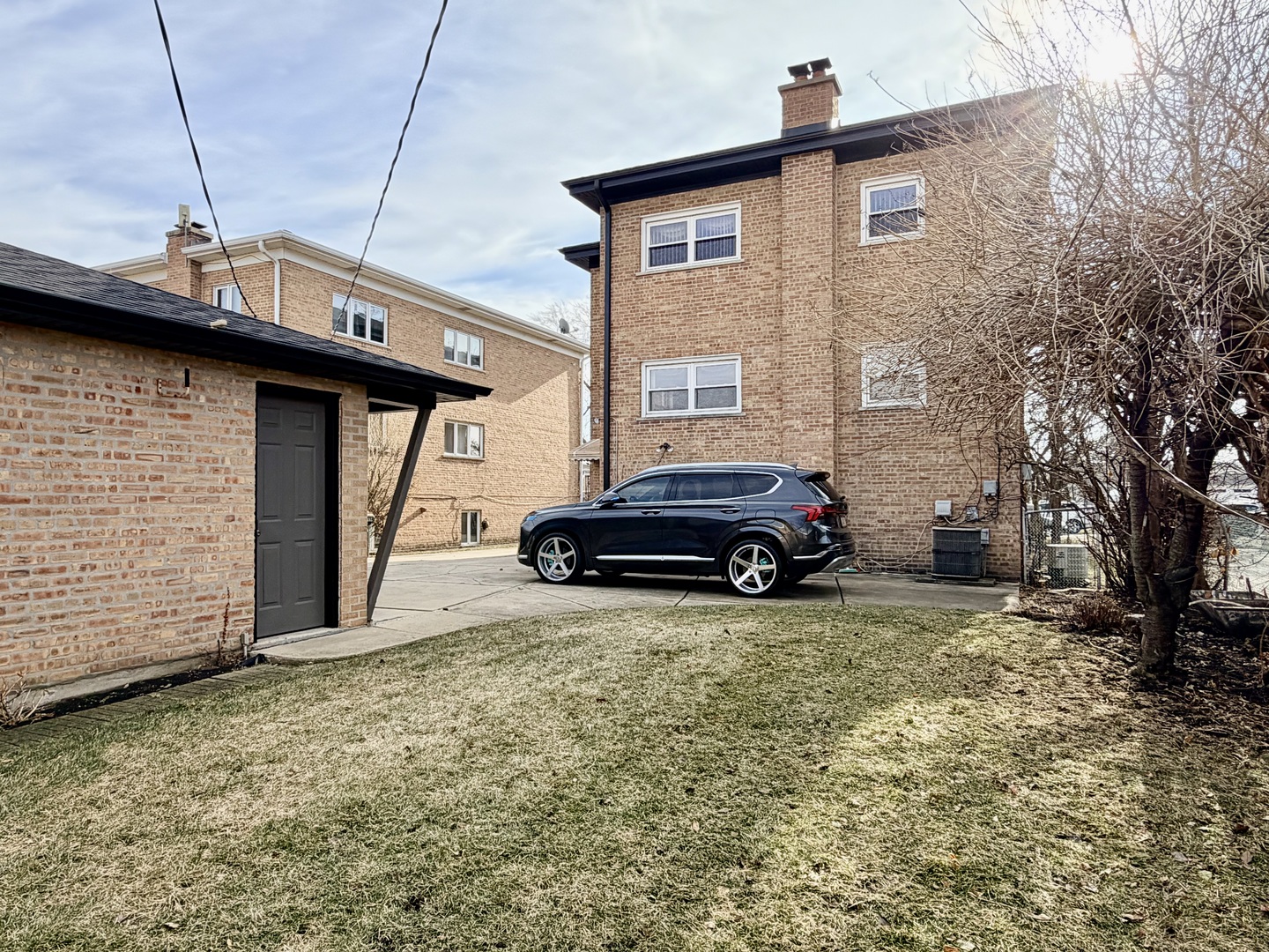 7238 West Crain Street, Unit G Niles, IL 60714 - Photo 10 of 11 a car parked in front of a house