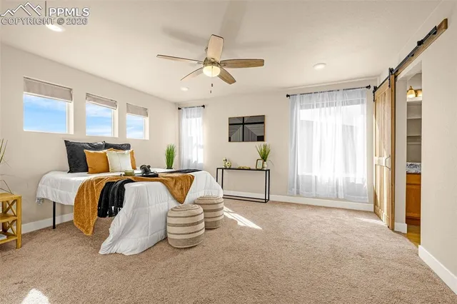 a bedroom with bed and window