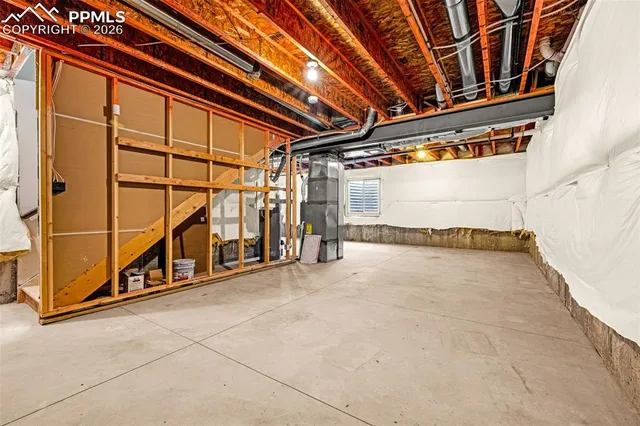 a view of an empty room with storage