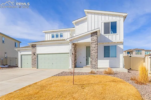 a front view of a house with a garage