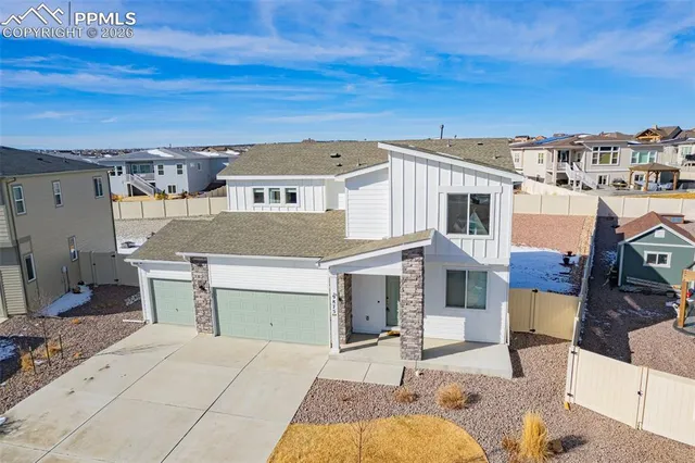 a view of residential houses with outdoor space