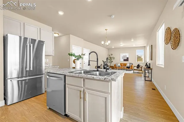 a kitchen with counter top space cabinets and stainless steel appliances