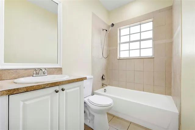 a bathroom with a sink a toilet and a bathtub