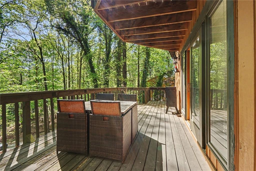 2530 Rockbridge Road Northwest Conyers, GA 30012 - Photo 38 of 45 a view of balcony with wooden floor and outdoor seating