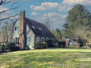 289 Kenyon Road Morris, CT 06763 - Photo 1 of 1 a front view of a house with a garden